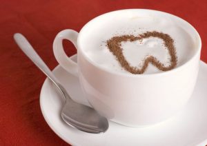 The Toothful Exchange Logo is a cup of coffee with a tooth in the cream.